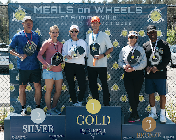 men and women on podium